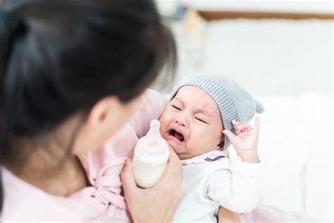 Baby crying while bottle-feeding