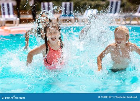 Happy child splashing in water