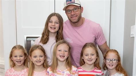Adam Busby with his daughters