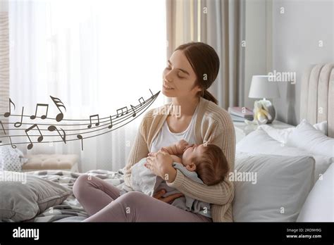 A mother rocking her baby while singing a lullaby
