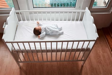 Baby comfortably sleeping in crib