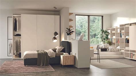 Cameretta con zona notte e studio separate dal colore