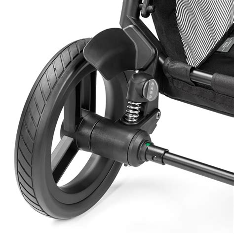Esploso tecnico delle ruote di un passeggino modulare Peg Perego con evidenza dei copriruote
