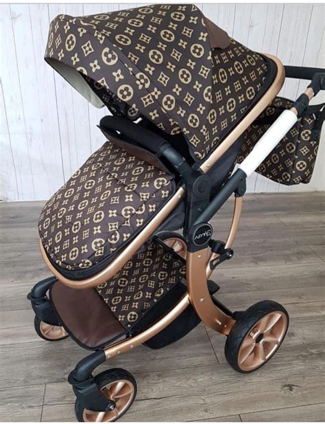 Louis Vuitton branded stroller with child in it