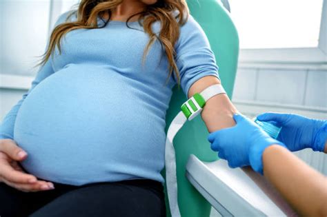 Pregnant woman getting blood test