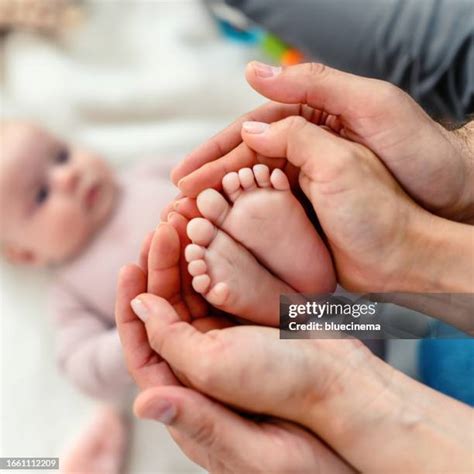 image of a parent massaging a baby's feet