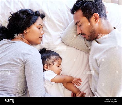 Happy father and baby sleeping