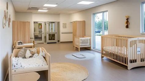 A nursery nap room with cribs and soft lighting