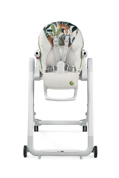 Child happily eating in a Peg Perego highchair