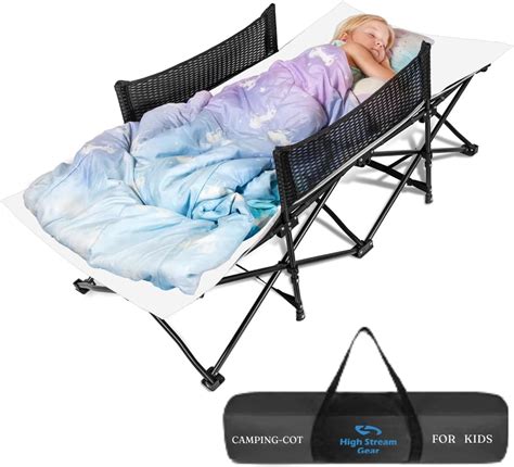 Child sleeping comfortably in a portable cot outdoors