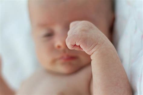 Newborn with clenched fists
