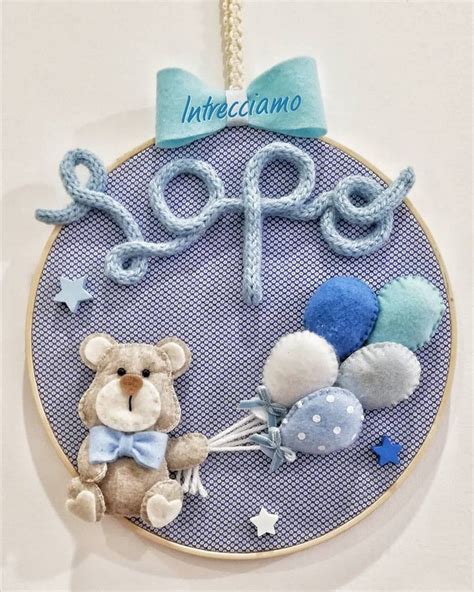 fiocco nascita realizzato con telaio da ricamo e applicazioni in feltro