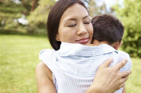 Mother hugging son too tightly, symbolically