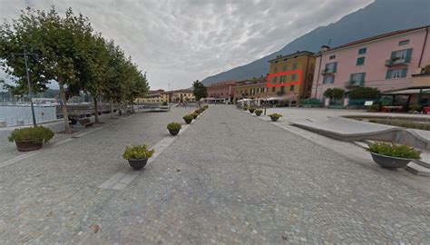 Immagine del centro di Colico con negozi e persone che passeggiano