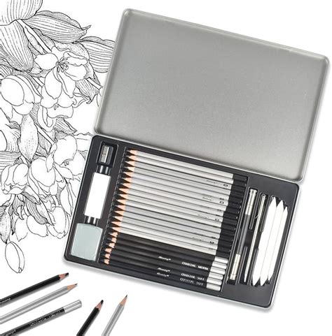 set di matite da disegno e blocco schizzi su un tavolo da lavoro