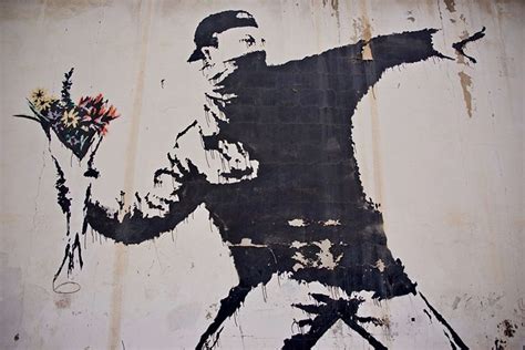 Banksy Flower Thrower graffito edificio Betlemme