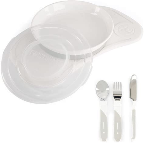 Un set completo di stoviglie per l'autosvezzamento che include piatto a ventosa, bicchiere e posate ergonomiche