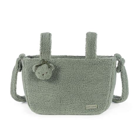 Borsa fasciatoio Gala Mint posizionata su un passeggino in un parco cittadino