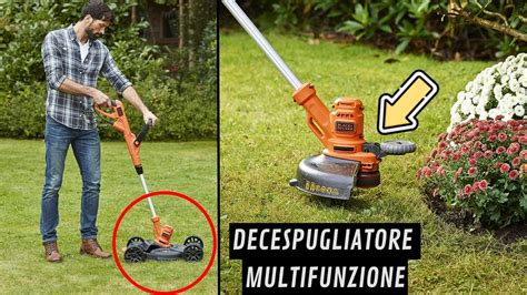 operatore che utilizza uno spargitore a carrello su un prato ben curato