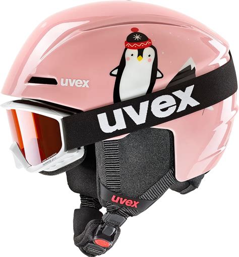 Bambino con casco da sci e paraschiena