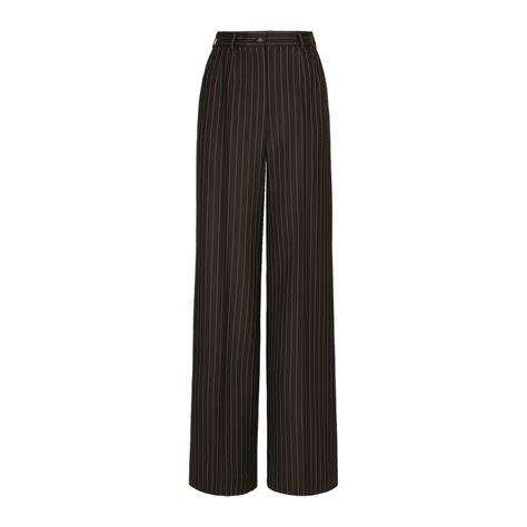 Tutina di paillette minimal con corpetto a bustier e pantaloni gessati