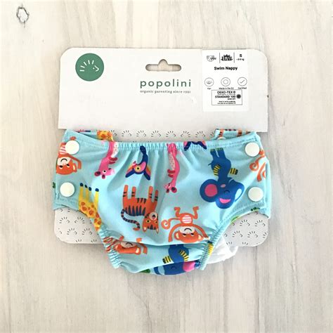 costume contenitivo per neonato con dettagli elastici