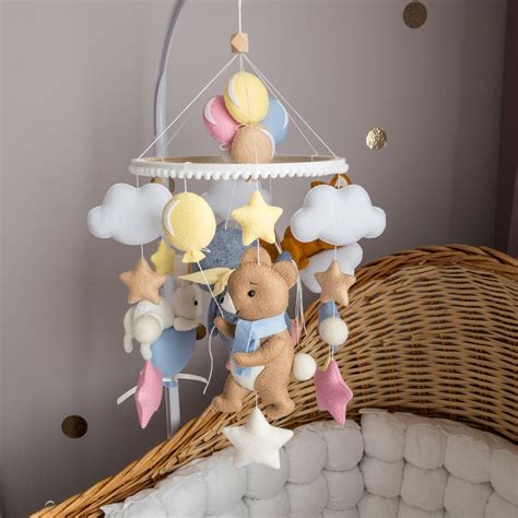 Image of a baby looking at a colorful mobile