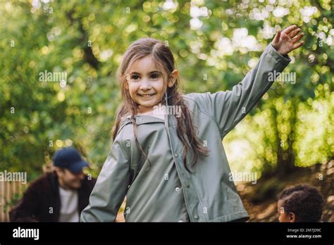 girl playing in a park wearing a stylish jacket