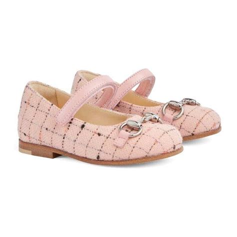 Bambina con ballerine Gucci