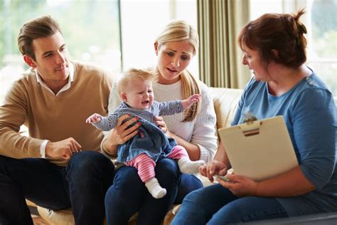 family with baby and social worker