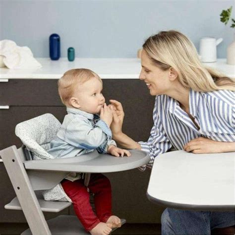 Stokke Tripp Trapp chair in storm grey with child